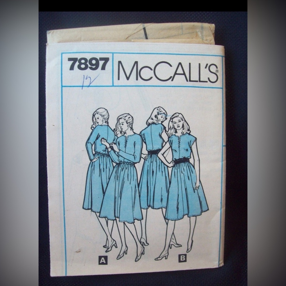 Vintage McCalls Pattern 7897 
Elastic Waist Dress 
Size 12 
Uncut
c. 1970s